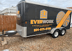 Rear of the Everwork trailer showing the logo and phone number